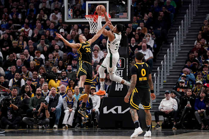 Milwaukee Bucks forward Giannis Antetokounmpo (34) dunks the ball over Golden State Warriors forward Trayce Jackson-Davis (32) 